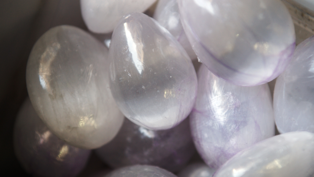 Close-up of tumbled selenite stones showcasing their translucent quality.