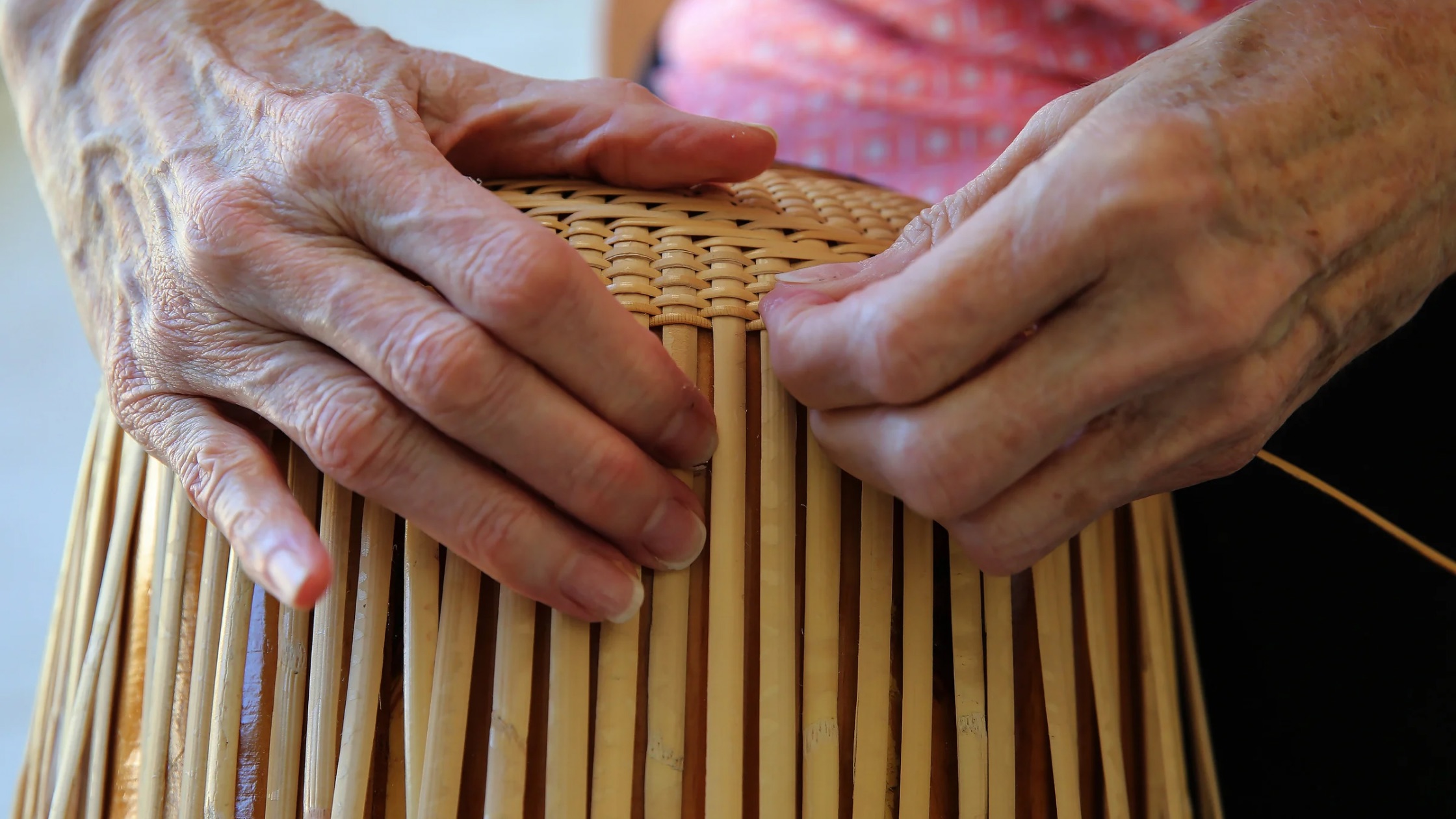 Image of a basket weaver making a Nantucket lightship basket